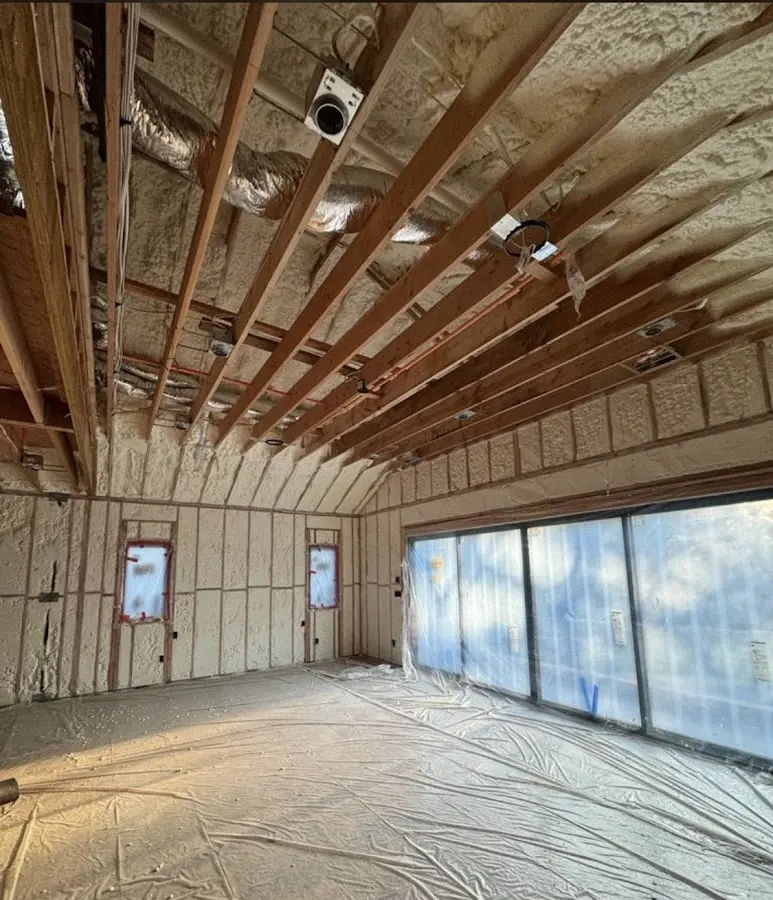 Interior walls and ceiling insulated with spray foam during new construction in Round Lake Park